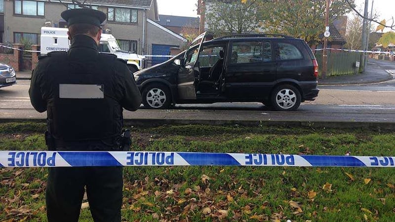 The man was shot as he sat in a car outside a house in Rossnareen Avenue