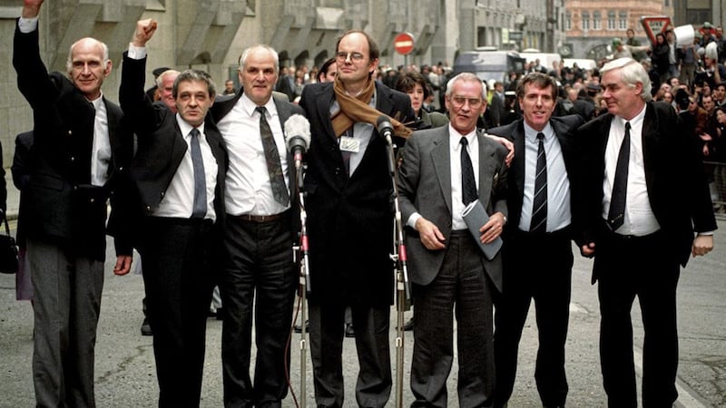 The Birmingham Six (left to right) John Walker, Paddy Hill, Hugh Callaghan, Chris Mullin MP, Richard McIlkenny, Gerry Hunter and William Power, outside the Old Bailey in London, after their convictions were quashed on March 14 1991. Picture by Sean Dempsey, Press Association 
