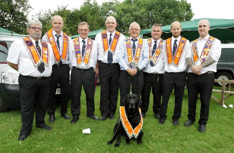 Orangemen and a dog taking part in a field gathering in 2015. Picture by Cliff Donaldson
