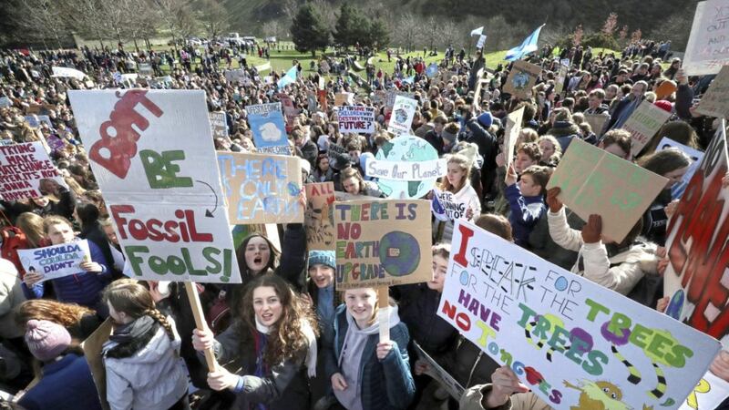 Students at a global school strike for climate change outside the Scottish Parliament building in Edinburgh 
