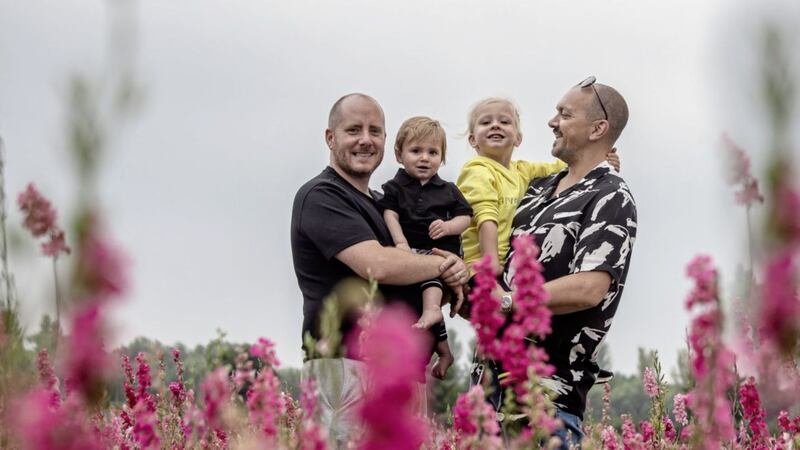 Wes and Michael Johnson-Ellis, with their two children Duke, Talulah, who were carried by a surrogate 