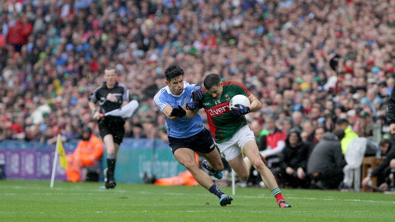Mayo's Jason Doherty drives past Dublin's Cian O'Sullivan during last Sunday's drawn All-Ireland final at Croke Park<br />Picture by Colm O'Reilly&nbsp;