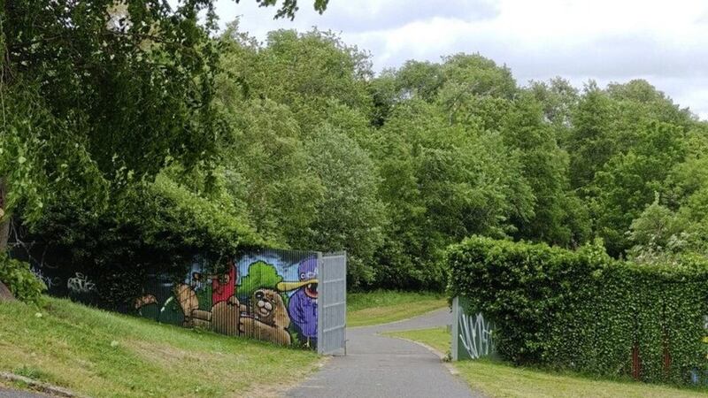 The peace wall and gate at Alexandra Park in north Belfast.