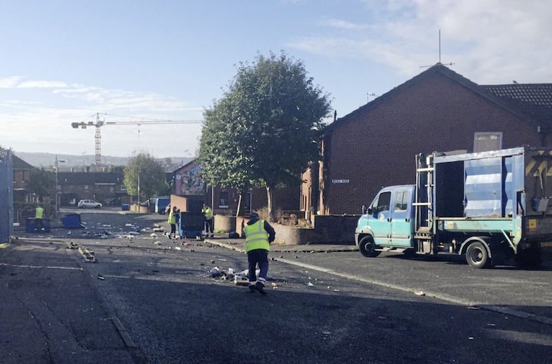 RETRANSMITTED CHANGING LOCATION FROM MARKETS AREA TO DIVIS AREA Cleaning up begins in the Divis area of Belfast, where Police have been attacked and cars torched by masked youths apparently angered by the removal of wood from the site of a nationalist bonfire in Belfast. PRESS ASSOCIATION Photo. Picture date: Tuesday August 8, 2017. The disturbances, close to the city centre, saw officers targeted with petrol bombs, bricks and bottles while a number of cars were totally destroyed. See PA story ULSTER Markets. Photo credit should read: David Young/PA Wire 