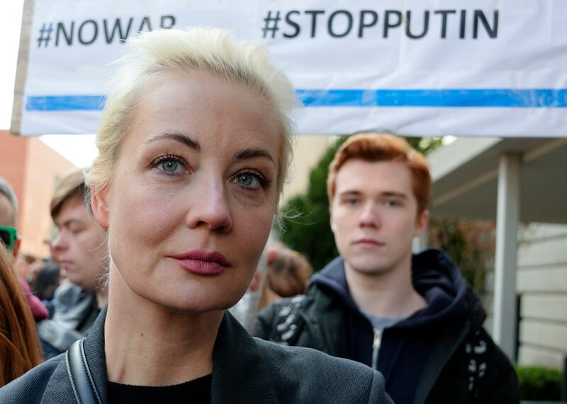 Yulia Navalnaya, centre, widow of Alexei Navalny, stands in a queue with other voters at a polling station near the Russian embassy in Berlin (Ebrahim Noroozi/AP)