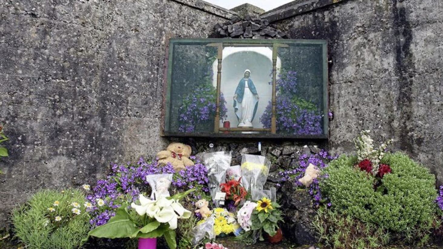Flowers laid at the scene of a mass grave, where the remains of almost 800 babies were found, in Tuam, Co Galway.