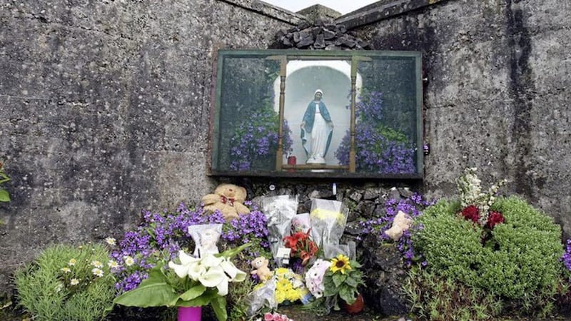 Flowers laid at the scene of a mass grave, where the remains of almost 800 babies were found, in Tuam, Co Galway. 