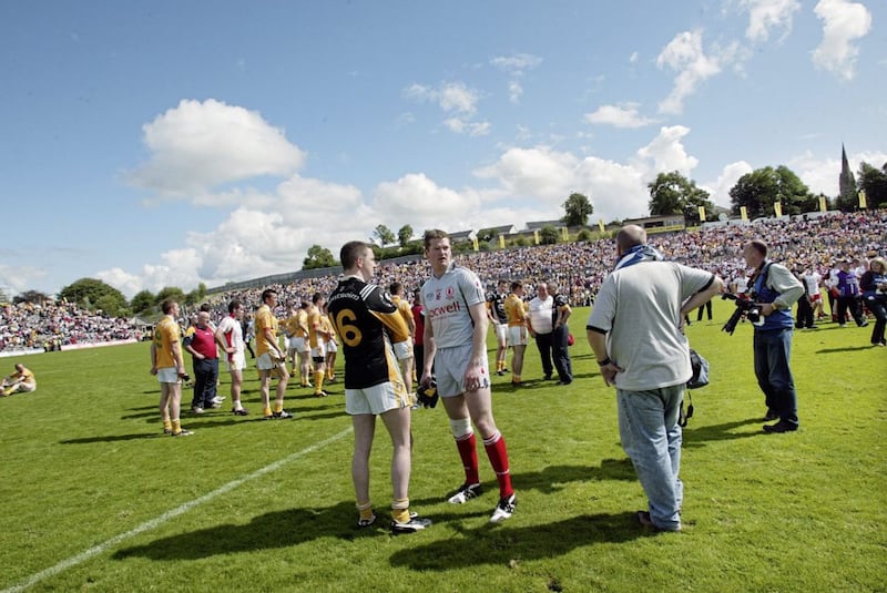 Antrim goalkeeper John Finucane and Tyrone's PascalMcConnell share a moment together after the Ulster Final at Clones. Picture: Seamus Loughran