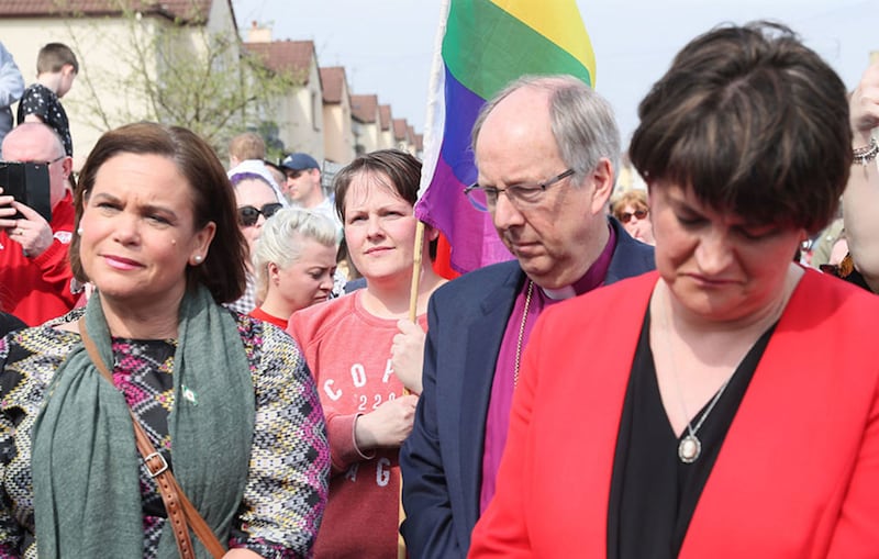 &nbsp;Sinn Fein President Mary Lou McDonald (left) and DUP leader Arlene Foster with Sara Canning, the partner of Lyra McKee behind them carrying a rainbow flag. Picture by Brian Lawless, PA Wire