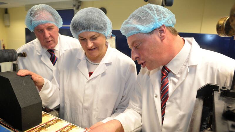 Then enterprise minister Arlene Foster is pcitured at Label One&#39;s premises at Ballygomartin Industrial Estate Lee Willdridge and Michael McGarry from the firm, which has now been acquired by CCL 