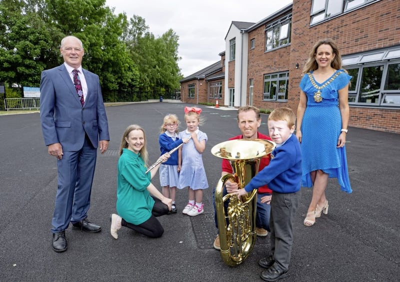 The Crescendo workshop at Holy Evangelists&#39; Primary School in Twinbrook (L-R): Liam Hannaway, Arts Council of Northern Ireland chairman, Ulster Orchestra player Jennifer Sturgeon, students Cara Fitzsimmons and Ruby Christie Whelan, Ulster Orchestra player Stephen Irvine, Lord Mayor of Belfast Katie Nicholl and student Anthony Best 
