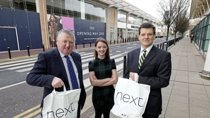 Pictured earlier this year outside the new Next store in Newry are CBRE&#39;s Colin Mathewson with Cathal Austin and Katie Mulligan of The Quays 