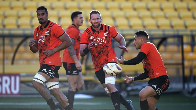 New Zealand half-back Aaron Smith (right) passes to team-mates captain Kieran Read and loose forward Jerome Kaino (left) during a training session in Wellington, New Zealand today, Thursday June 29 2017