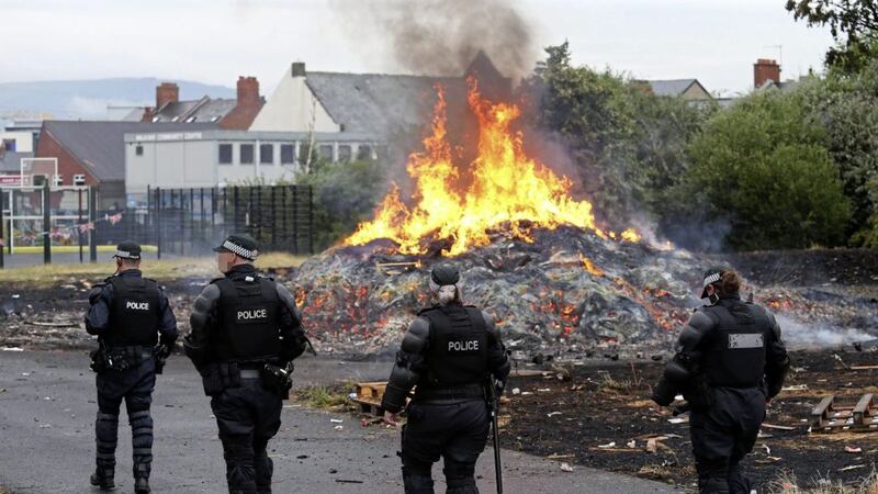 Police presence at the Bloomfield Walkway bonfire after it was set alight prematurely as contractors were about to remove it. Picture by Mal McCann 
