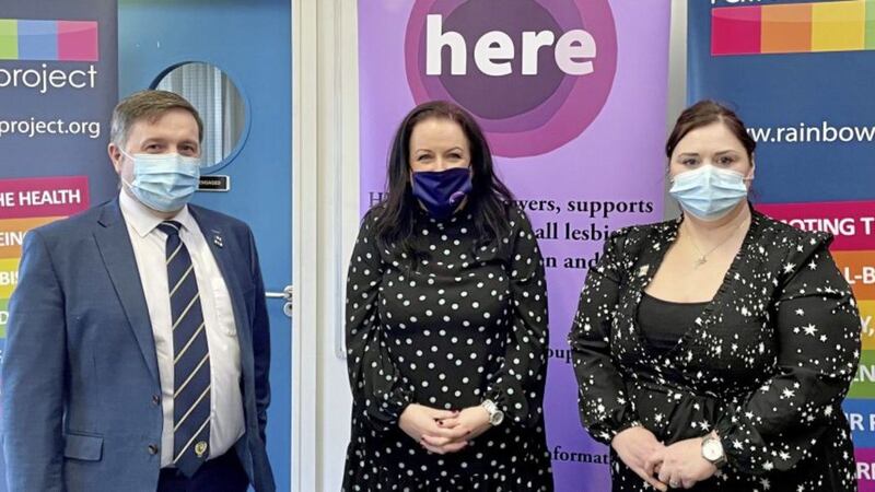 Health Minister Robin Swann with Cara McCann, Director of HERe NI and Aisling Twomey, Policy and Advocacy Manager at The Rainbow Project 