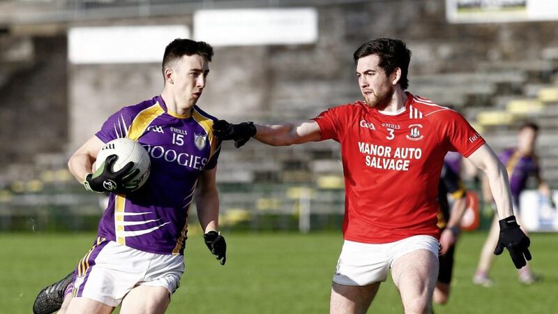 Trillick&#39;s Ruairi Kelly moves in to block Derrygonnelly&#39;s Garvin Jones. Picture by Philip Walsh. 