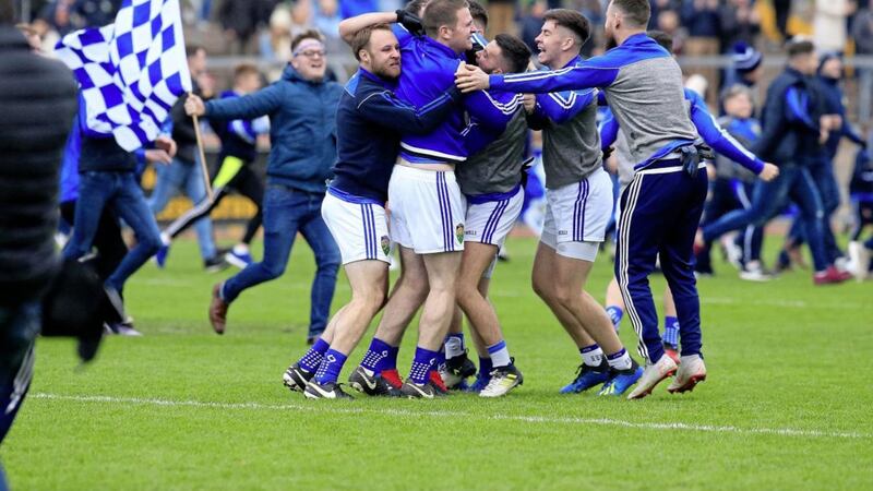 Joy for Coalisland fans and players on the final whistle in Healy Park.<br /> Picture by Philip Walsh