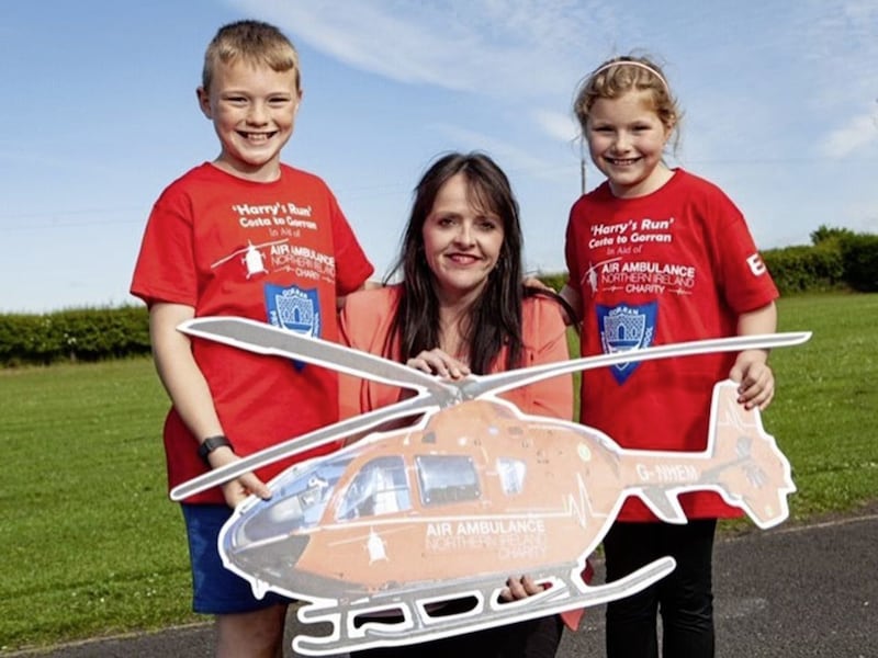 Harry and Ellie Smyth pictured with Michelle McDaid of the NI Air Ambulance 