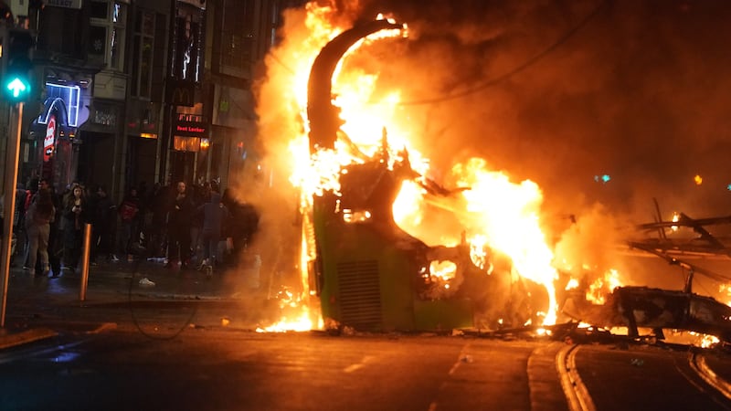 A bus on fire in O’Connell Street in Dublin city centre 