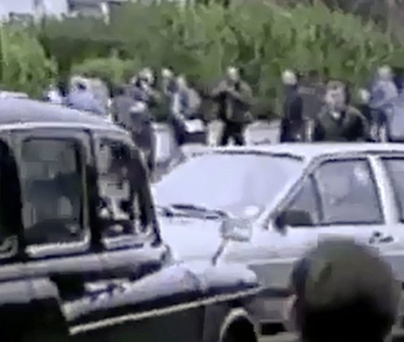 Irish News reporter Allison Morris at the far right corner of the picture as the corporals car drove into the funeral cortege. 