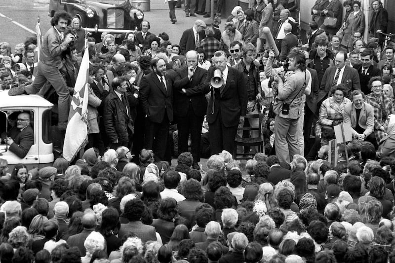 Dr Ian Paisley, gripping a loud speaker during an address to a massed gathering of supporters in the Shankill Road area of Belfast. The Ulster Workers' Council declared that "everything" in the north "stops at midnight" in an attempt to bring down the power sharing executive brought about by the Sunningdale Agreement