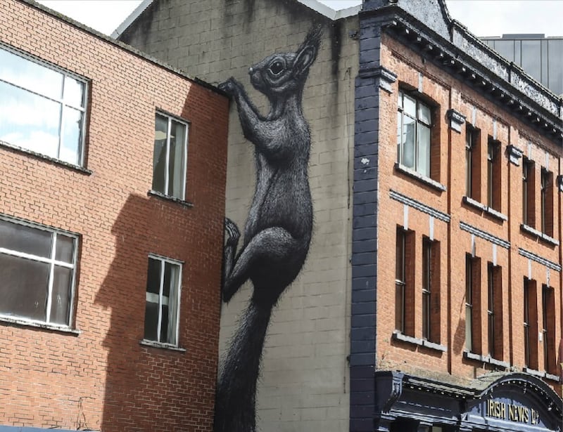 A giant squirrel painted on the side of the Irish News building in Donegall Street, created by Belgian artist R.O.A. Picture by Hugh Russell