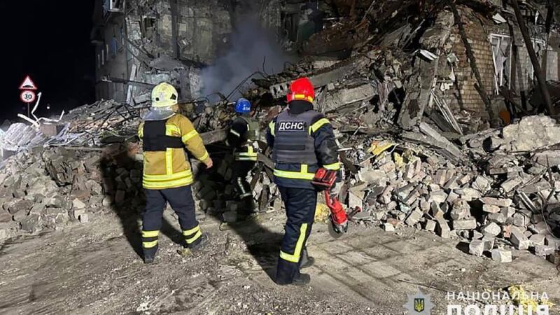 Rescuers work at the scene of a building damaged by shelling in Pokrovsk, Ukraine, on Thursday (National Police of Ukraine via AP)