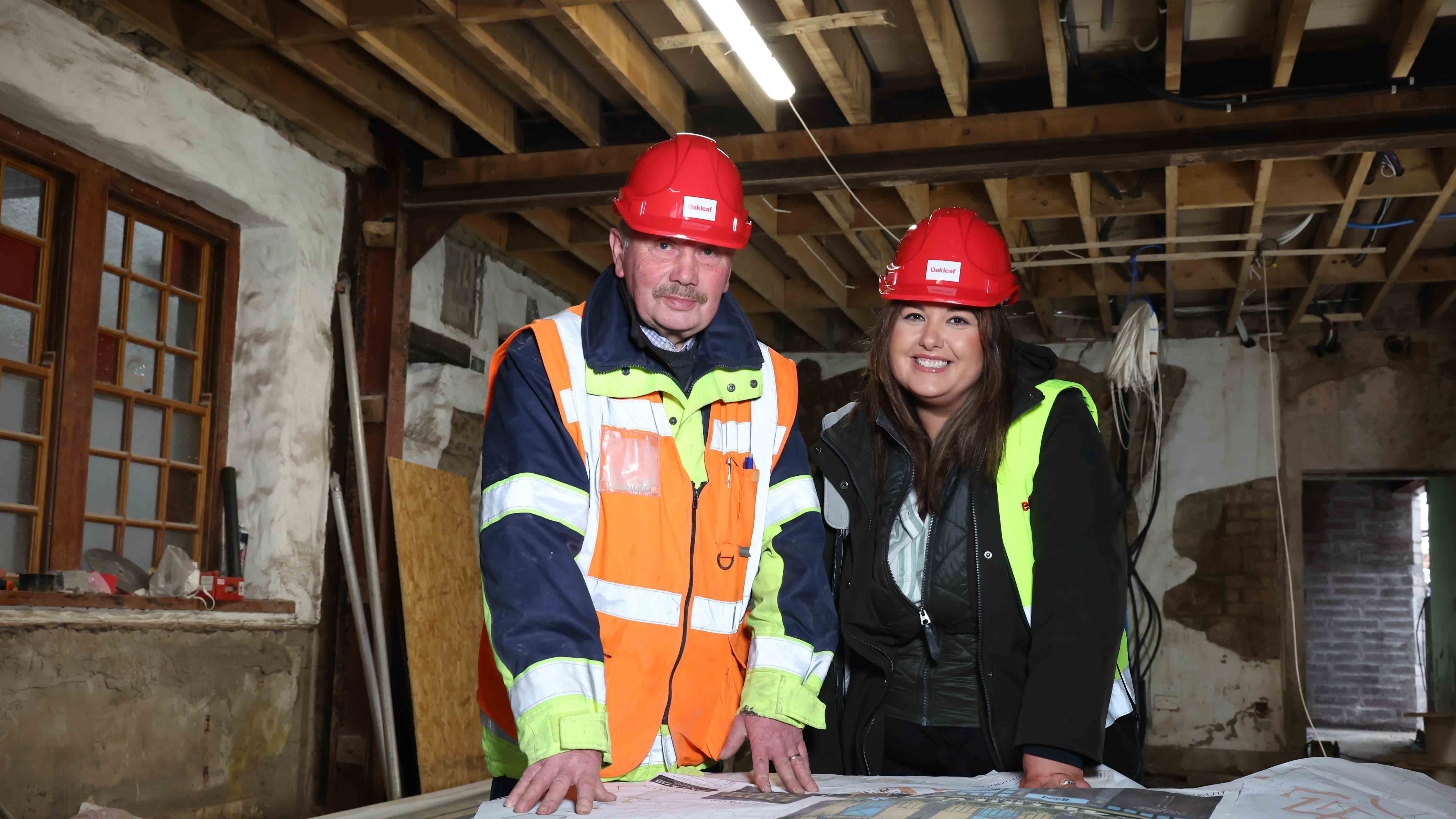 Oakleaf's Neil McCloy and Nicolette Campbell examine the plans for the former Central Inn pub in Cookstown, which will be transformed into a new venue this summer.