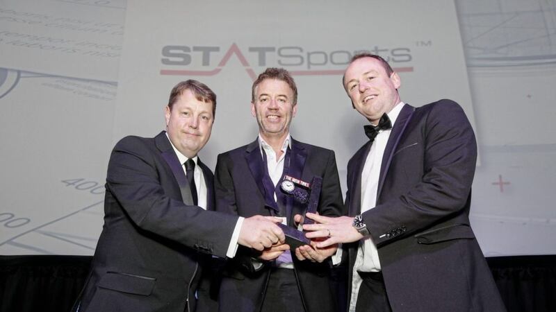 Ciaran Hancock, Irish Times business editor presenting The Irish Times Deal of the Year Award 2018 to Jarlath Quinn, group managing director of StatSport and Paul McKernan, chief customer and information officer. 