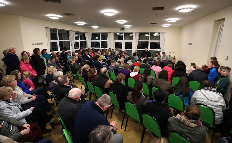 People pray for brother and sister Fintan and Mary O'Neill at Kickhams Creggan GAC club. Picture by Declan Roughan&nbsp;