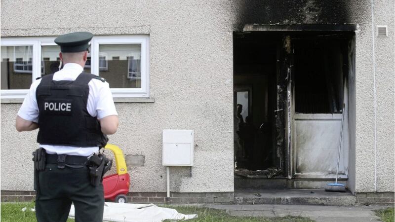 A family had to navigate their eight children down stairs to within two feet of the blazing front of their home following what police say was an arson attack with intent to endanger life. Picture by Hugh Russell 