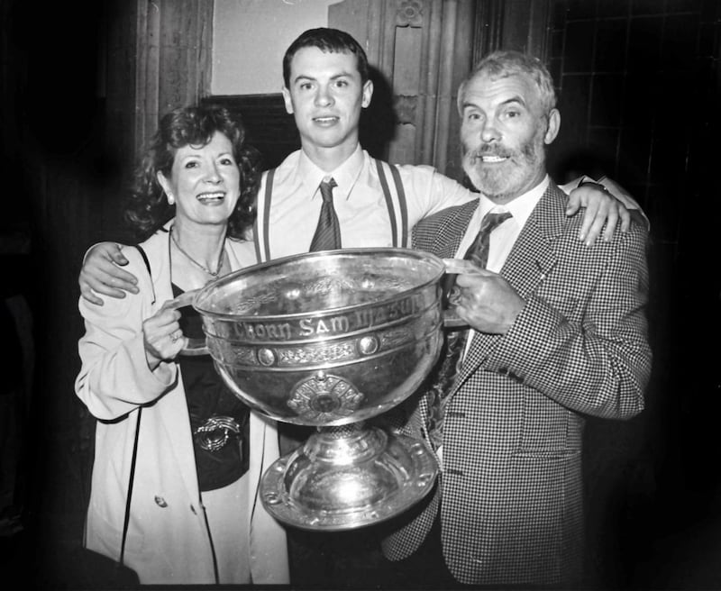 Joe Brolly with his parents Francie and Anne and the Sam Maguire Cup after Derry won the All-Ireland Senior Football Championship&nbsp; in 1993. Picture from Derry Journal