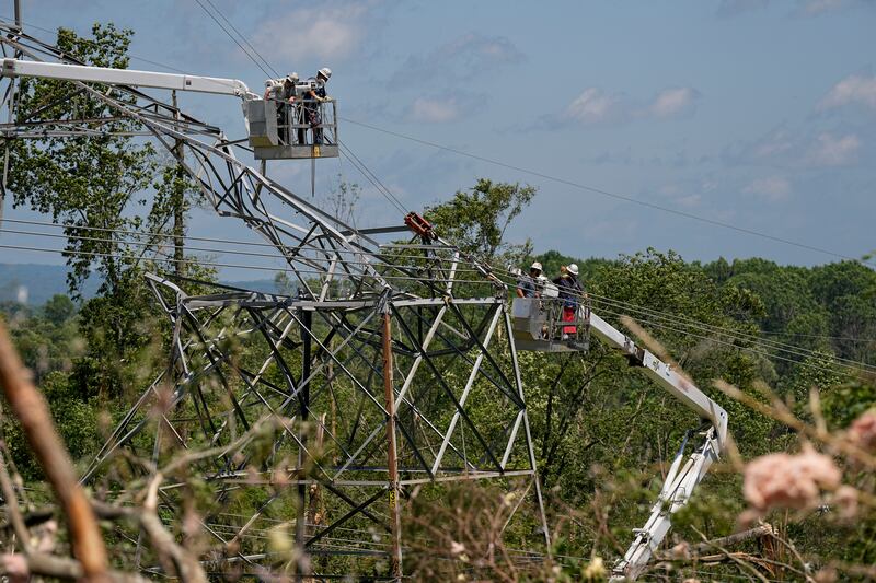 Utility workers repair a TVA tower in Tennessee (George Walker/AP)