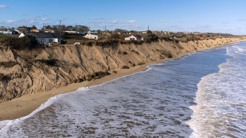 Homes close to the cliff edge at Hemsby in Norfolk in February 2023 (Joe Giddens/ PA)