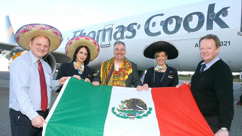 From left, Uel Hoey, Belfast International Airport Business development director; James Burrows, aviation director, Thomas Cook Airlines; Graham Keddie, Belfast International Airport managing director, flankked by Thomas Cook Airlines cabin crew Kellie O&rsquo;Hara and Jennie Little 