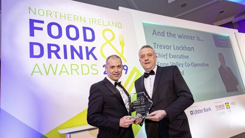 Nigel Walsh, director (corporate and commercial banking) at Ulster Bank, presents Fane Valley chief executive Trevor Lockhart with the outstanding contribution to the industry award at the 15th NI Food and Drink Awards. 