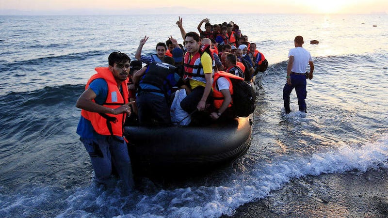 Migrants and refugees in a rubber dinghy arriving on the beach at Psalidi near Kos Town, Kos, Greece. Picture: Jonathan Brady/PA 