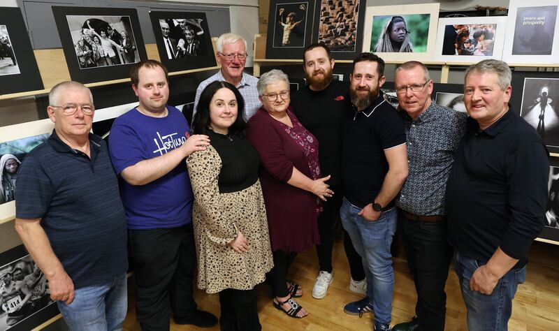 Kathy Russell (wife) and children  Hugh , Hayley, James and Callum with members of the camera club at  A exhibition of Hugh Russell’s work to celebrate 40 years of Photography at Christian Brothers camera Club in North Belfast. 
PICTURE COLM LENAGHAN