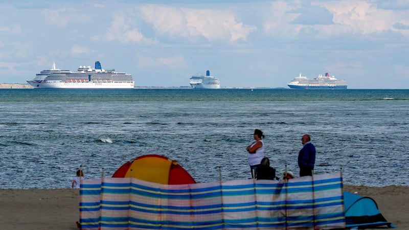A view of the cruise ships from Studland beach (Steve Parsons/PA)