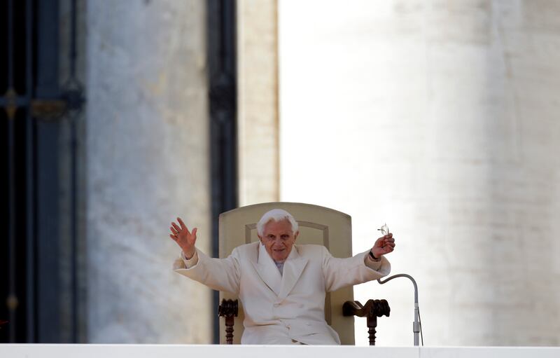 Pope Benedict XVI waves to the faithful during his final general audience in St Peter’s Square at the Vatican in February 2013 (Gregorio Borgia/AP)
