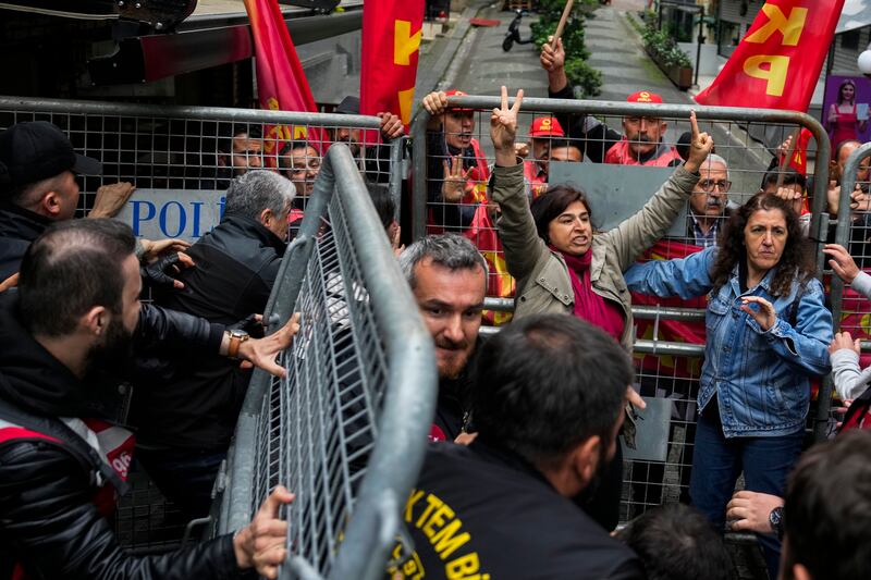 Union members scuffle with Turkish police during Labour Day celebrations in Istanbul (Khalil Hamra/AP)