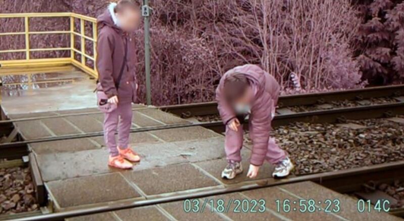 Two boys were caught on camera placing stones on the railway track