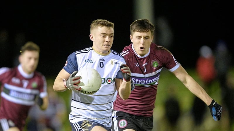 Ulster University&#39;s Paddy McLarnon comes under pressure from Ryan Coleman of St Mary&#39;s during last night&#39;s Ryan Cup clash at Jordanstown. Picture by Mark Marlow 