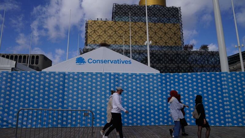 People walk past the International Convention Centre in Birmingham ahead of the Conservative Party annual conference (Aaron Chown/PA)