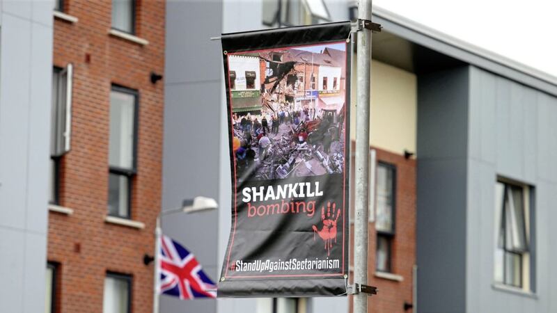 The banners depict IRA attacks including the La Mon, Shankill and Bloody Friday bombings. Picture by Mal McCann 