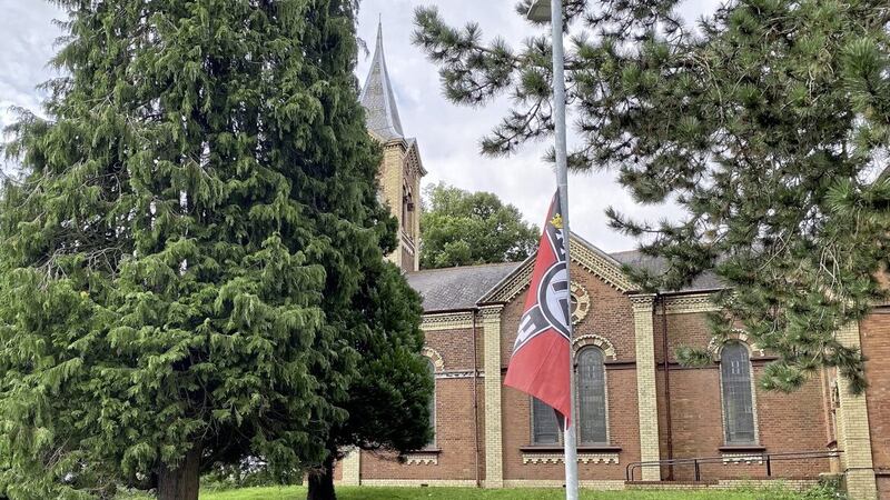 Flags bearing Nazi symbols pictured outside the Iqraa mosque in Dunmurry