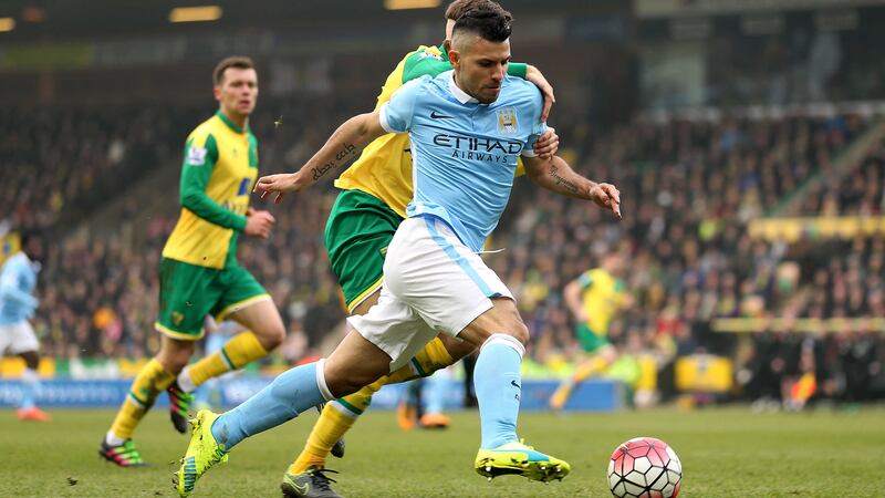 Norwich City's Gary O'Neil and&nbsp;Manchester&nbsp;City's Sergio Aguero (front) battle for the ball Saturday's Premier League match at Carrow Road