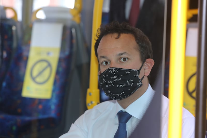 Taoiseach Leo Varadkar encouraging passengers to wear face masks on public transport in June 2020