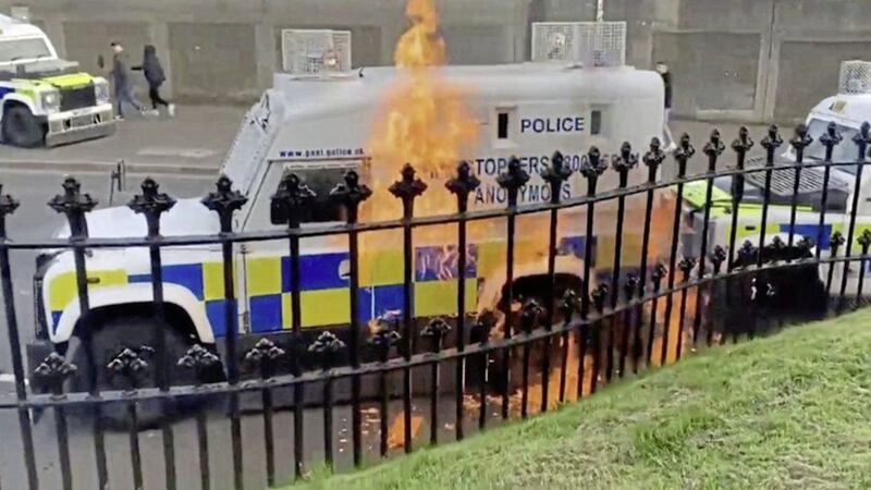 A PSNI vehicle comes under attack following a dissident republican-linked parade in Derry on Easter Monday. 