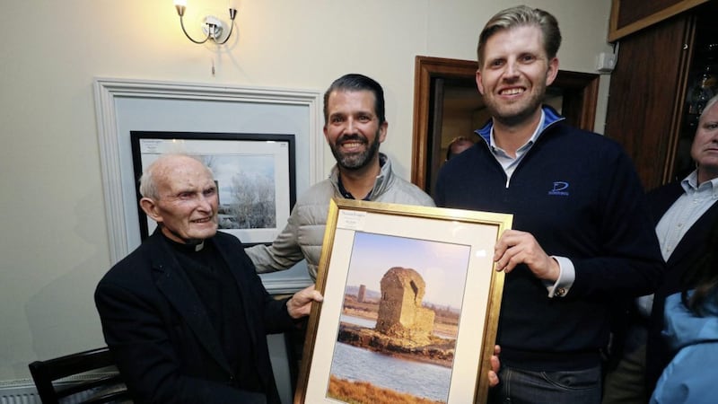 Donald Trump Jr. (centre), and Eric Trump (right), the sons of US President Donald Trump, with Fr. Joe Haugh (left) in Igoe's Pub in the village of Doonbeg, Co Clare, on the first day of US President Donald Trump's visit to the Republic. Picture by Brian Lawless/PA Wire